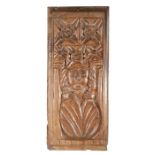 A rare early 15th century oak humorous secular carving, circa 1400 In the manner of a Sheela, with