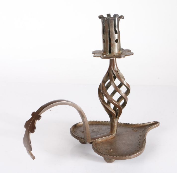 A decorative Arts & Crafts type wrought iron chamberstick, circa 1905 With heart-shaped base, open