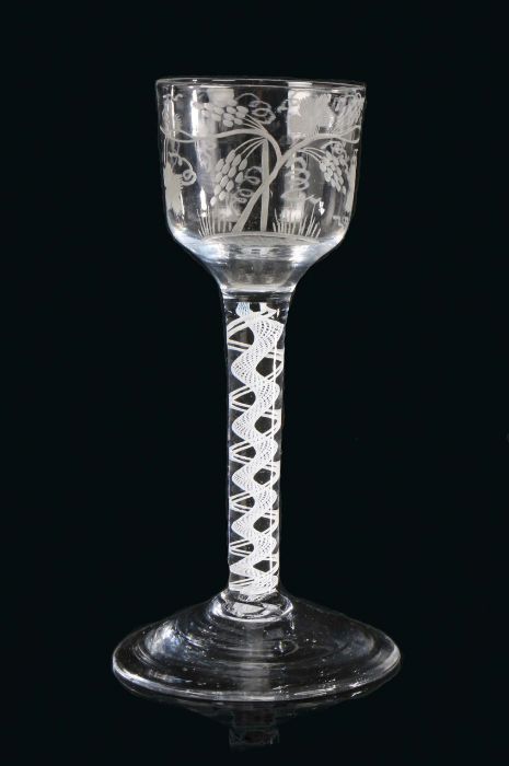 An 18th Century cordial glass, circa 1750 The squat bowl engraved with a tree with oversized