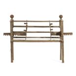 An 18th century wrought iron bar-grate The front of five bars, the upper bar dropping to form a
