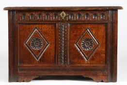 A small Charles I oak coffer, circa 1640 Having a twin-panelled lid, the front again with two