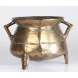 A small 17th century bronze cauldron, English Of typical form, with bag-shaped body, angular