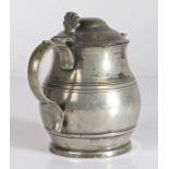 A Victorian pewter Imperial half-pint lidded ale jug,  circa 1850 The spouted bulbous body with