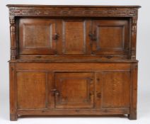 A small James I oak and elm court cupboard, West Country, dated 1611 The near one-piece top with