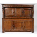 A small James I oak and elm court cupboard, West Country, dated 1611 The near one-piece top with