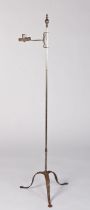 A steel standing candleholder, circa 1800 The round-section stem topped by an acorn and reeded