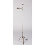 A steel standing candleholder, circa 1800 The round-section stem topped by an acorn and reeded