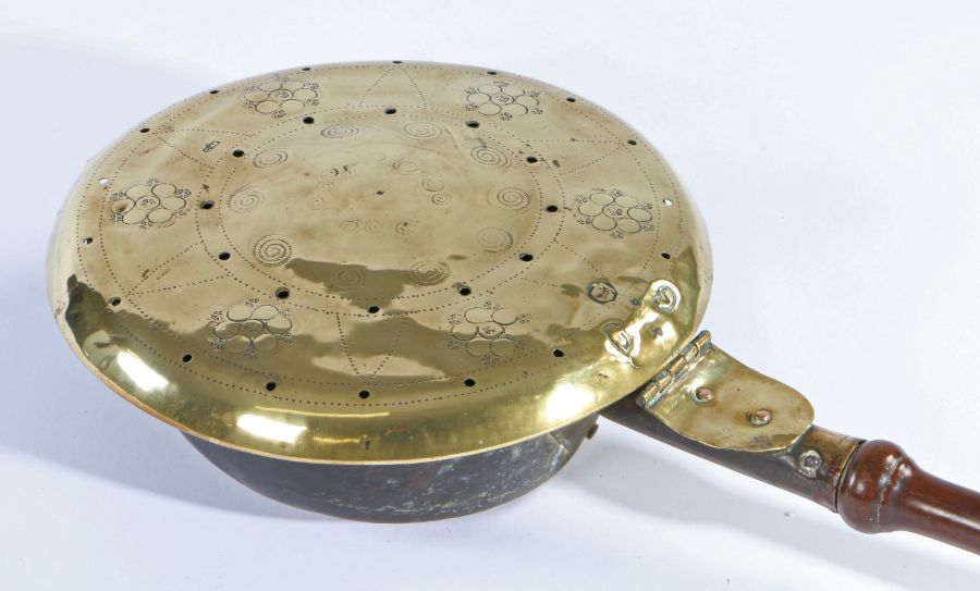 An early 18th century brass warming pan, with maker’s mark The domed pan cover decorated with - Image 3 of 3