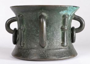 A bronze mortar in the English or Scottish 13th century Gothic manner With four split-column