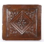 An Elizabeth I carved oak panel, circa 1590 Carved with a central lozenge, with stepped edges,