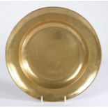 A rare George II brass plate, circa 1750 Having a gently curved single-reed rim, and incised line