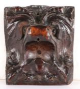 A rare 16th century ‘bullet’ wood mythical beast mask mount, circa 1550 Designed with open mouth and