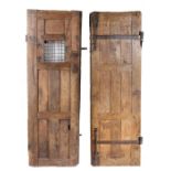 A pair of 17th century elm 'monastic' doors, South European Each of flush panelled construction, one