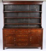 A George III oak and pine fully-enclosed high dresser, North Wales, circa 1790 The stepped rack