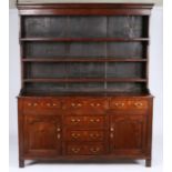 A George III oak and pine fully-enclosed high dresser, North Wales, circa 1790 The stepped rack