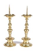 A pair of mid-17th century brass pricket candlesticks, German or Flemish, circa 1650 Each having a