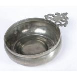 A Charles II pewter porringer, circa 1680 Having an old-English-ear with triangular bracket to the