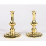 A pair of Victorian brass tapersticks, circa 1880 Each with baluster-shaped stem, peened over into a