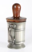 An early 19th century pewter pint mug with lignum-vitae ‘former’ or tankard jack, circa 1800 The