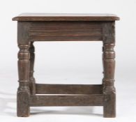 A Charles I oak low stool, circa 1640 Having a rectangular seat with triple-reeded edge, multiple