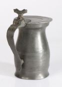 A pewter OEWS quart bud baluster measure, English, circa 1720-40 Having incised lines to lid and