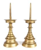 A pair of 16th century brass pricket candlesticks, German or Flemish Each with a long 4.75 inch