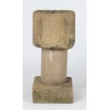 A 13th century gritstone mortar, English Of lobed form, on a later limestone pillar and plinth, 36cm