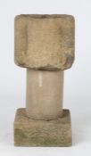 A 13th century gritstone mortar, English Of lobed form, on a later limestone pillar and plinth, 36cm