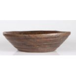 A George III turned walnut dairy bowl, circa 1780 With flat rim, and numerous narrow turned