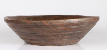A George III turned walnut dairy bowl, circa 1780 With flat rim, and numerous narrow turned