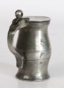 A pewter OEWS half-gill ball-and-bar baluster measure, English, circa 1700 The plain lid with