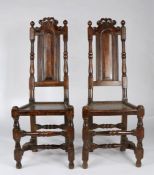 A pair of William & Mary oak and elm high-back side chairs, circa 1690 Each with a slender fielded