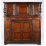 A Charles II oak boarded and panelled court cupboard, West Country, circa 1680 The boarded top