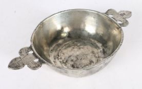 A 16th/17th century pewter twin-handled porringer, French The booged bowl with flat base and