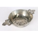 A 16th/17th century pewter twin-handled porringer, French The booged bowl with flat base and