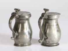 Two pewter OEWS gill double-volute baluster measures, English, circa 1770 One with a slightly