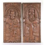 A pair of 16th century oak naively carved panels, circa 1500 Each designed as a standing saint,