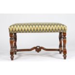 A walnut and upholstered stool, circa 1700 The rectangular seat upholstered in bargello