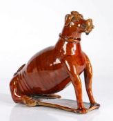 19th Century treacle glazed pottery dog flask, probably America Pennsylvania, the seated dog with