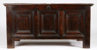 An Elizabeth I oak coffer, circa 1580 The lid of rare design, namely four panels arranged in a