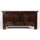 An Elizabeth I oak coffer, circa 1580 The lid of rare design, namely four panels arranged in a