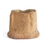 A rare and small stone mortar, probably 13th/14th century, English With an elongated buttress to