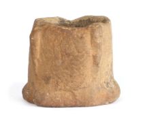 A rare and small stone mortar, probably 13th/14th century, English With an elongated buttress to