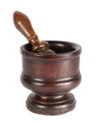 A stained walnut or fruitwood mortar, circa 1800 Of shallow cylindrical form, with moulded waist,