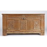 A 16th century oak coffer, Flemish  The hinged lid with four fielded and raised moulded panels,