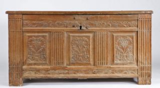 A 16th century oak coffer, Flemish  The hinged lid with four fielded and raised moulded panels,