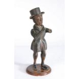 A 19th century polychrome-decorated folk art figure  Designed as a male, standing, wearing a tin top
