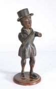 A 19th century polychrome-decorated folk art figure  Designed as a male, standing, wearing a tin top