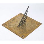 A 19th century brass engraved sundial, English With decorative gnomon, the square back plate
