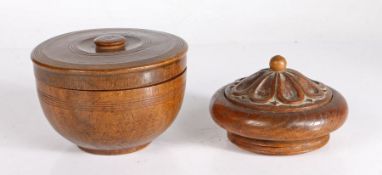 A 19th century fruitwood spice pot Lathe turned, with ring decoration to the sides and flat fitted